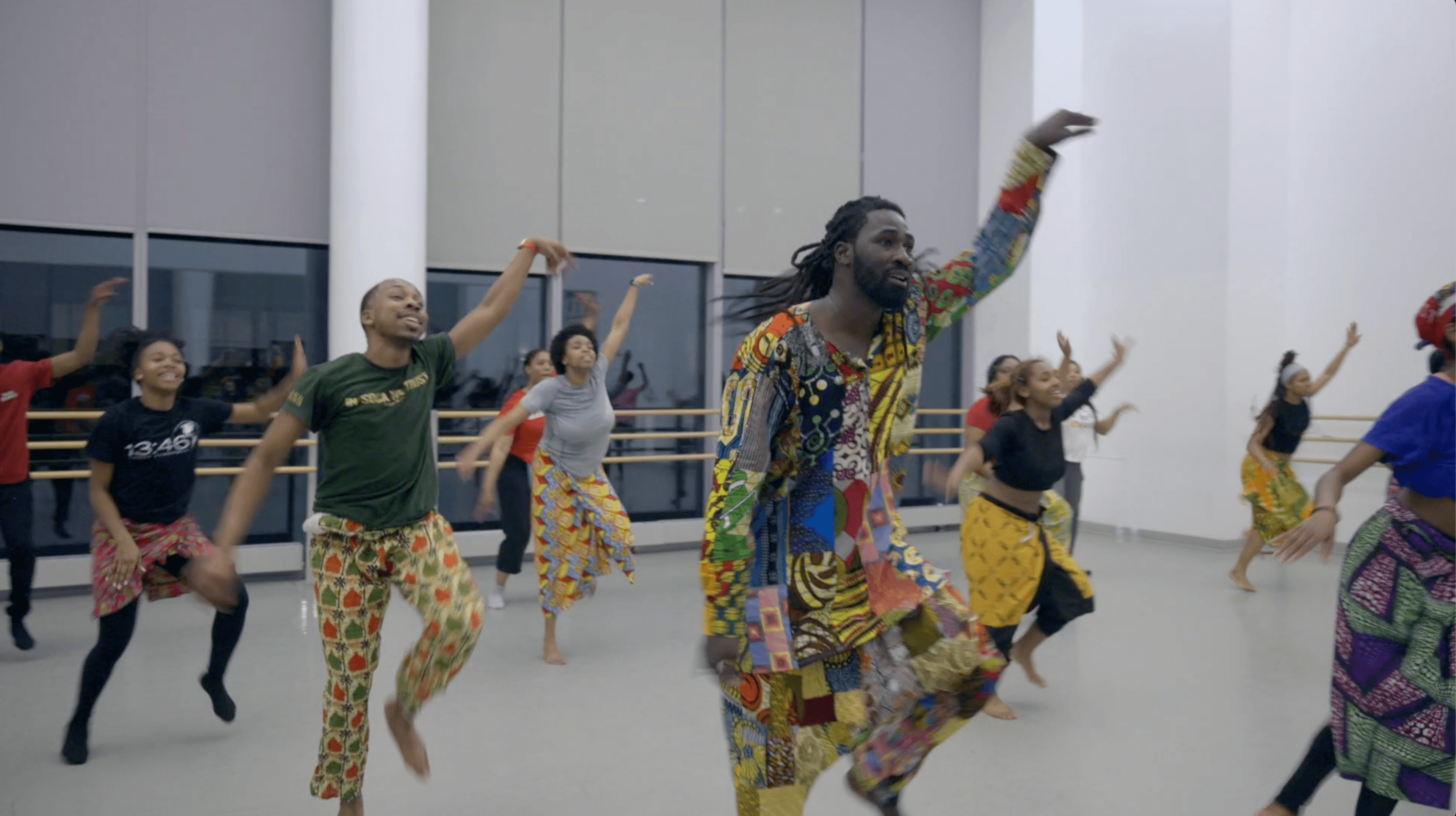 Sabar instructor Bakary Fall leading a group of students in class at the Ailey Studios