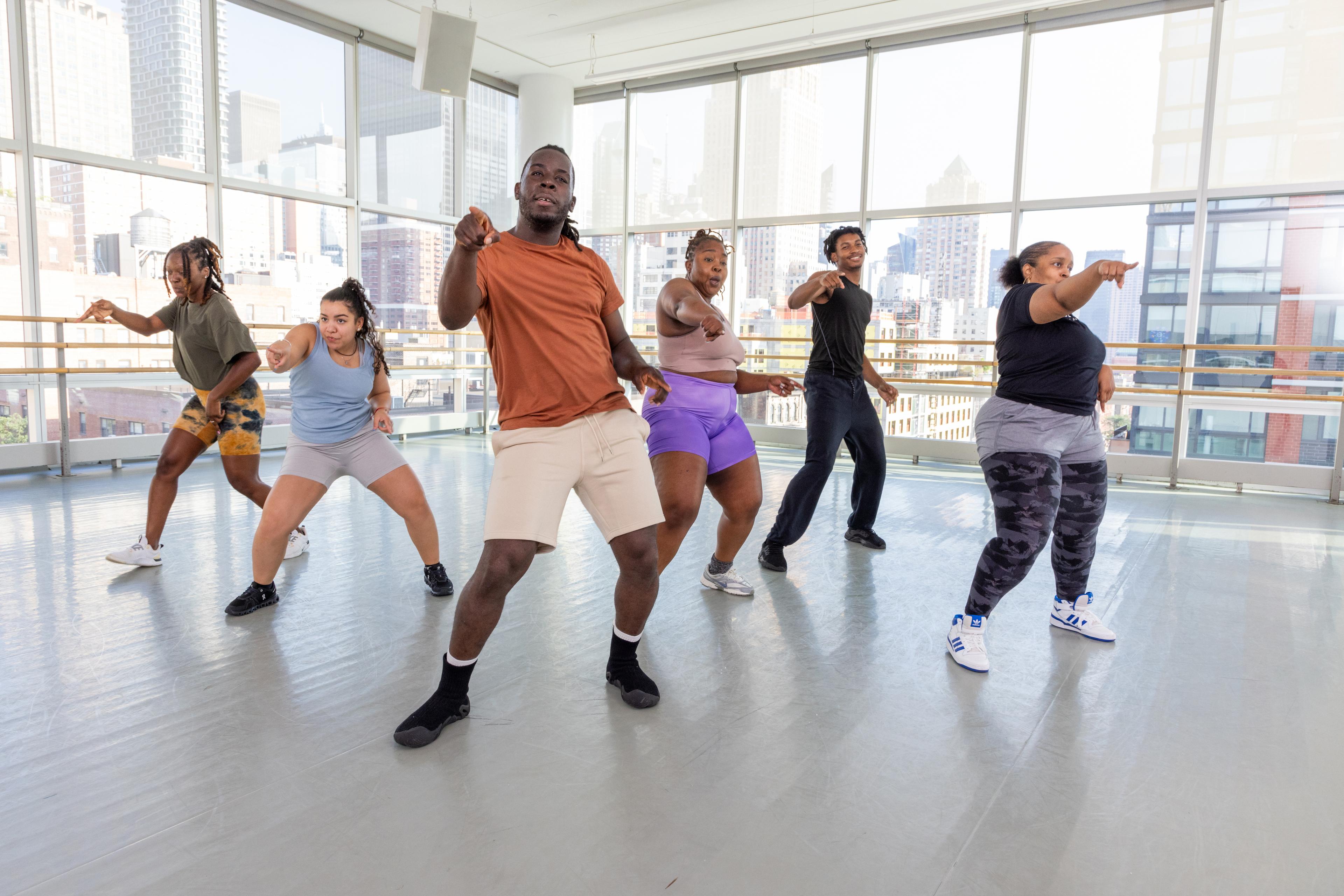 Dancehall class with students smiling led by LAS Dancers at the Ailey Studios