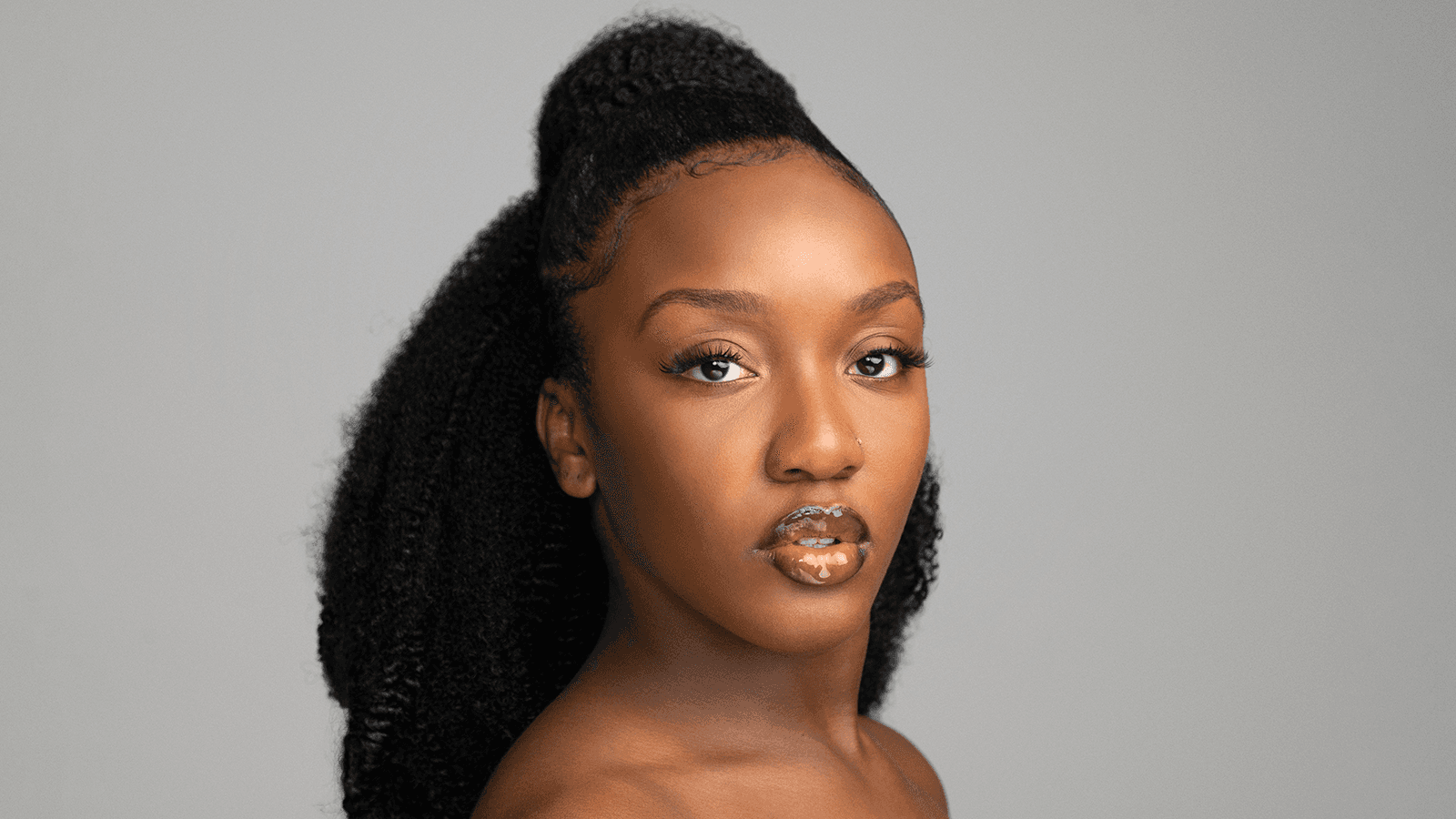 Headshot of Adanna Smalls, a dancer with long dark hair pulled back