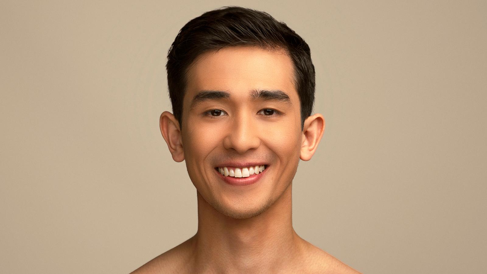 Headshot of Jesse Obremski, a dancer with short dark hair and a big smile
