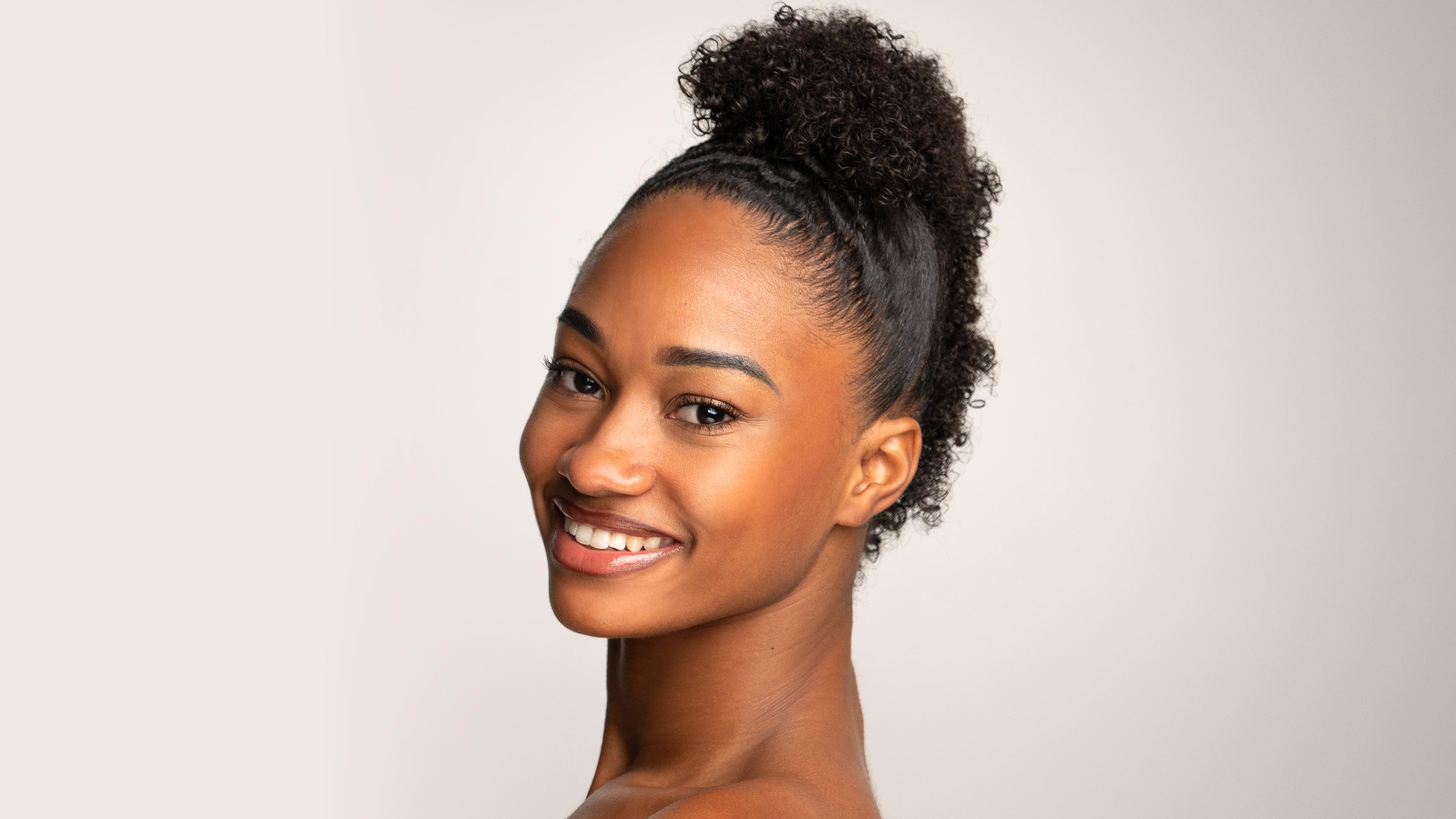 A headshot of Ami-Maxine Hill