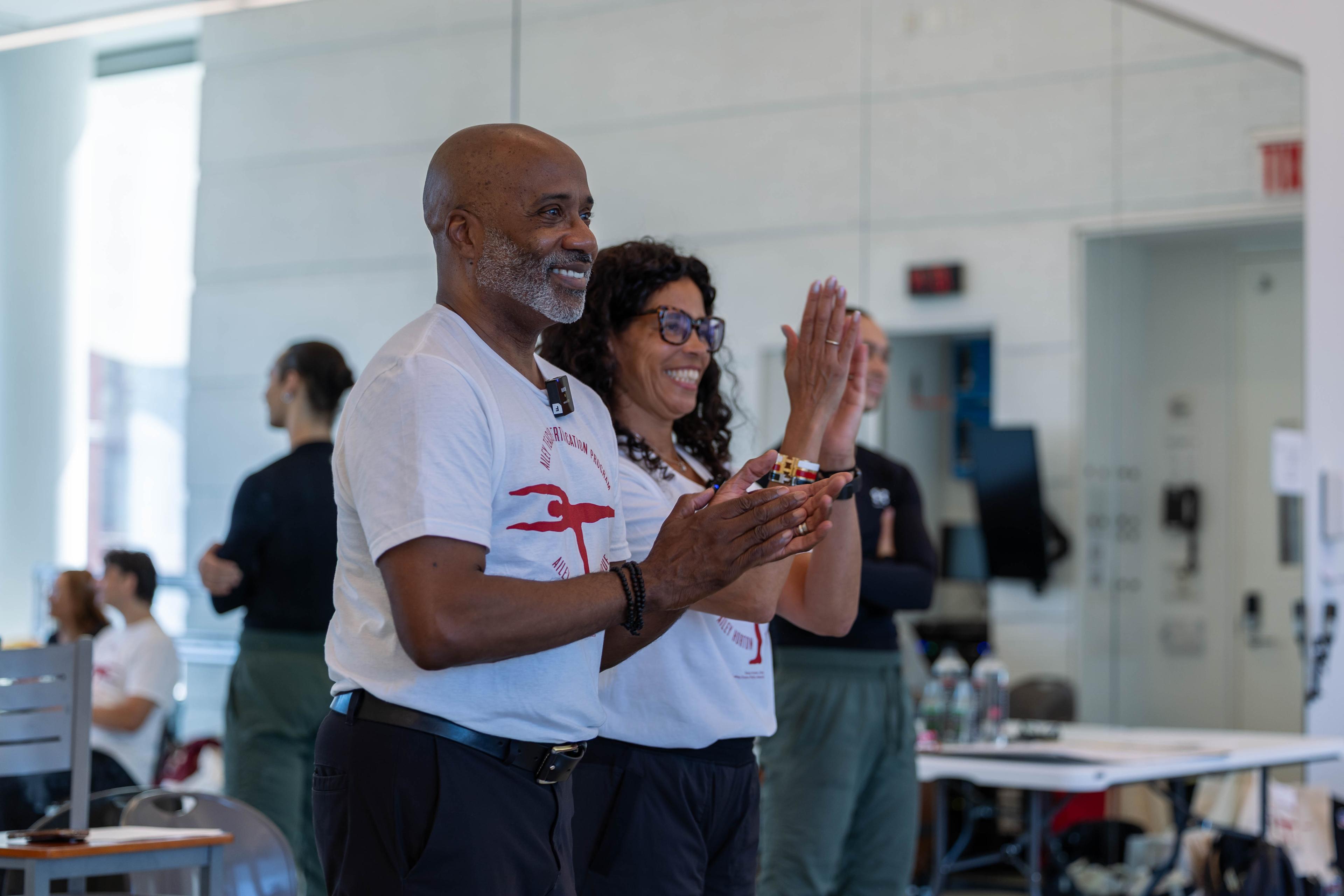 ATCP Director Tracy Inman and Lakey Evans-Peña applauding students during an ATCP workshop in the Ailey Studios