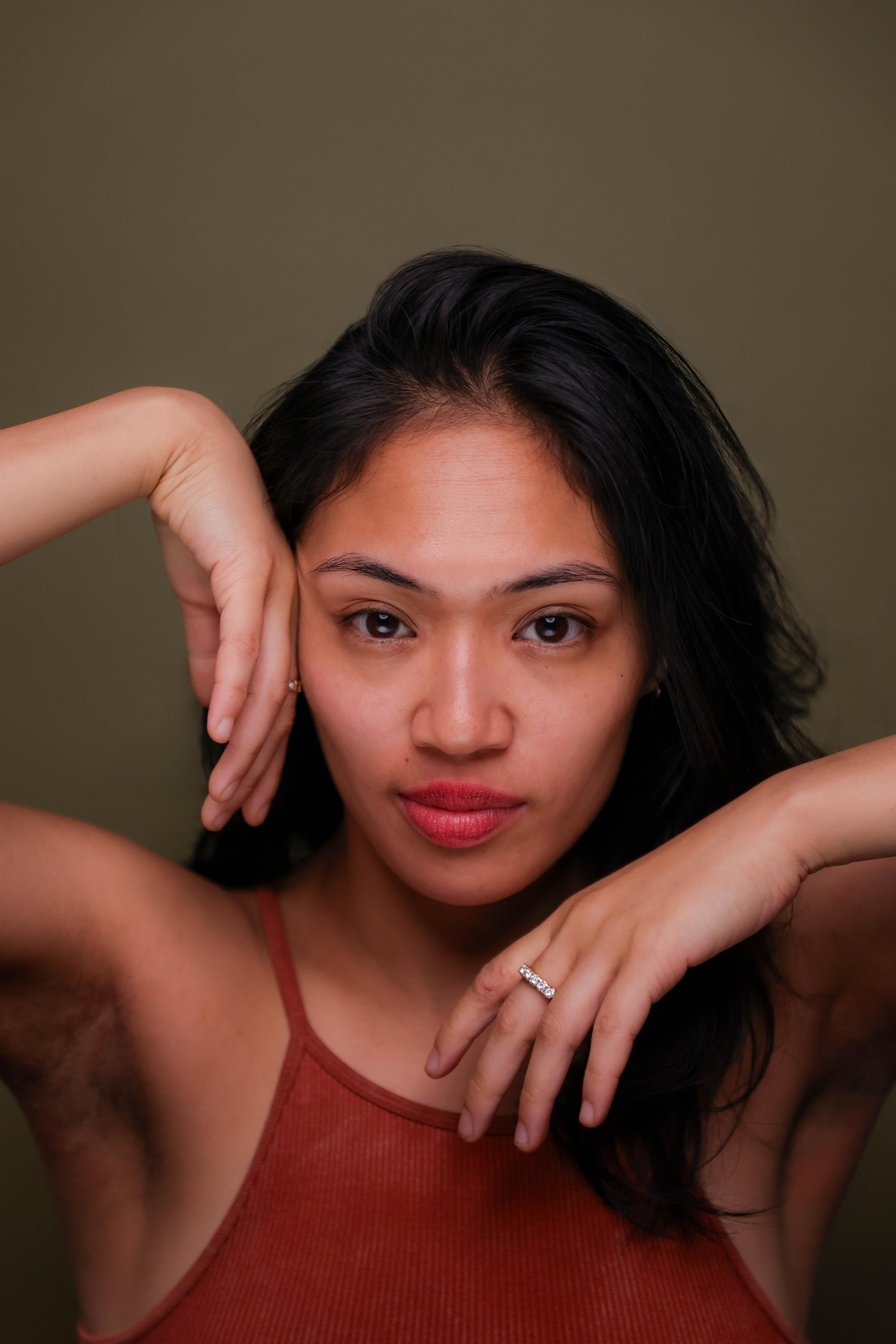 Keerati Jinakunwiphat's headshot on a olive green background