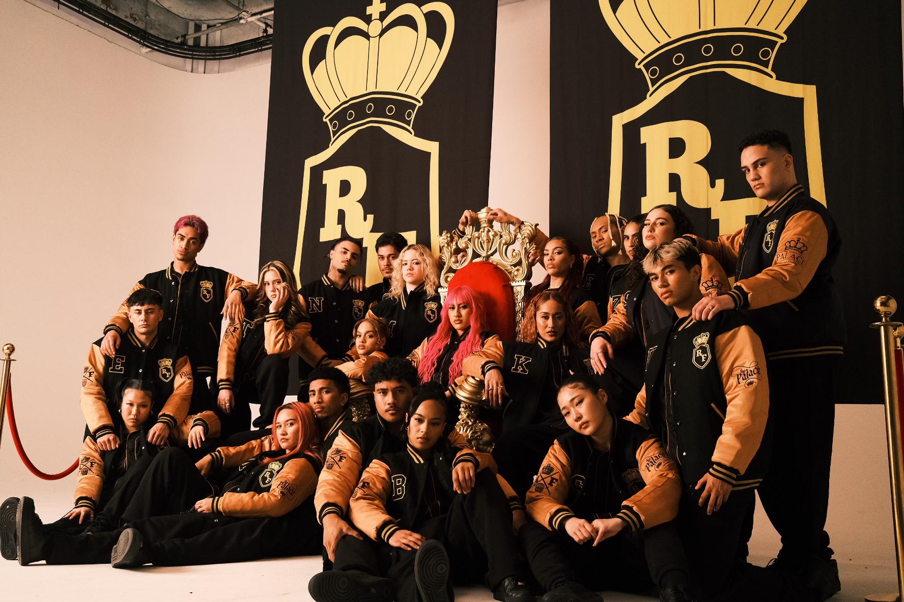 The Royal Family Dance Crew in matching outfits posing for a photo
