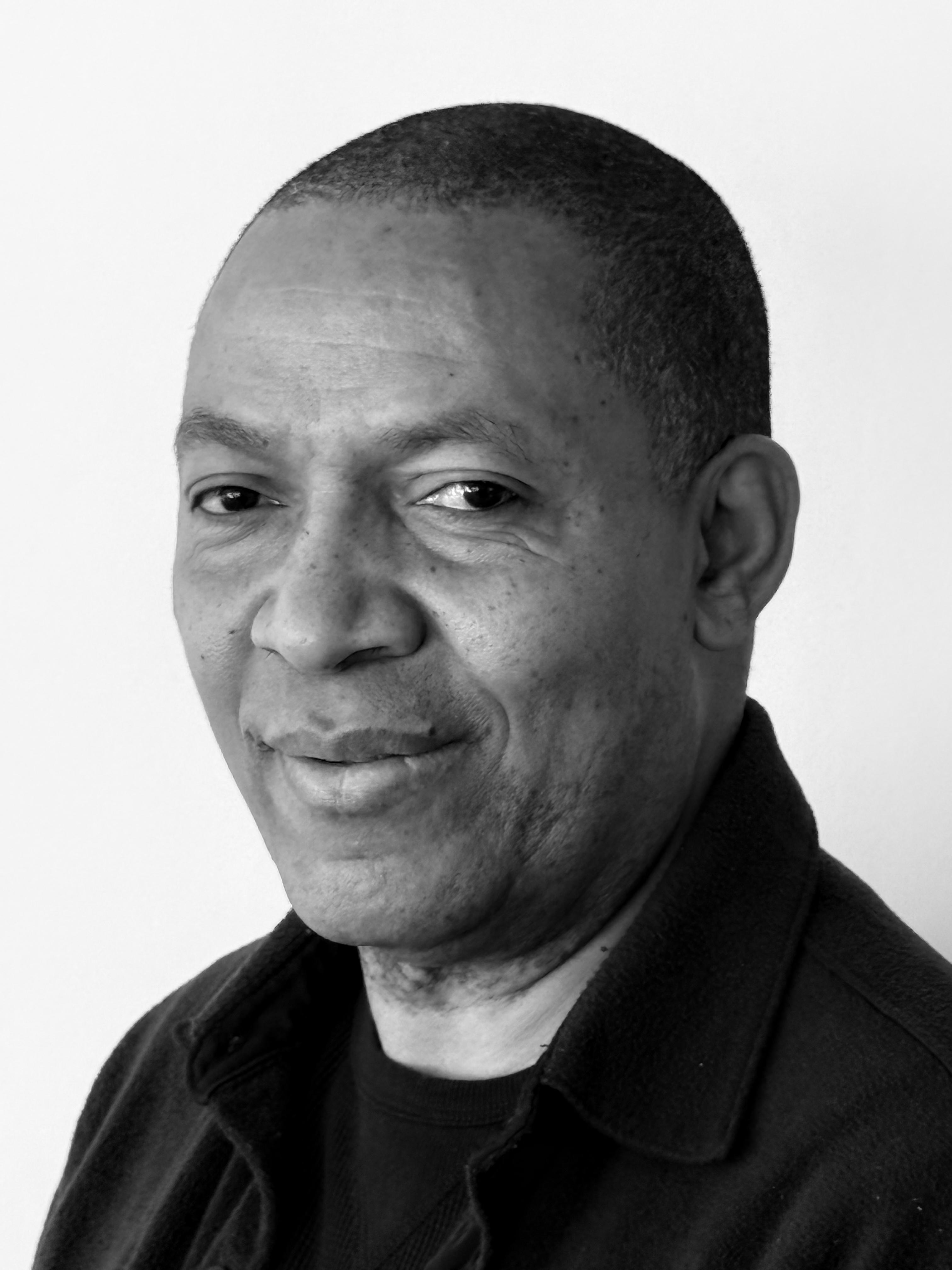 Julio Jean's headshot in black and white