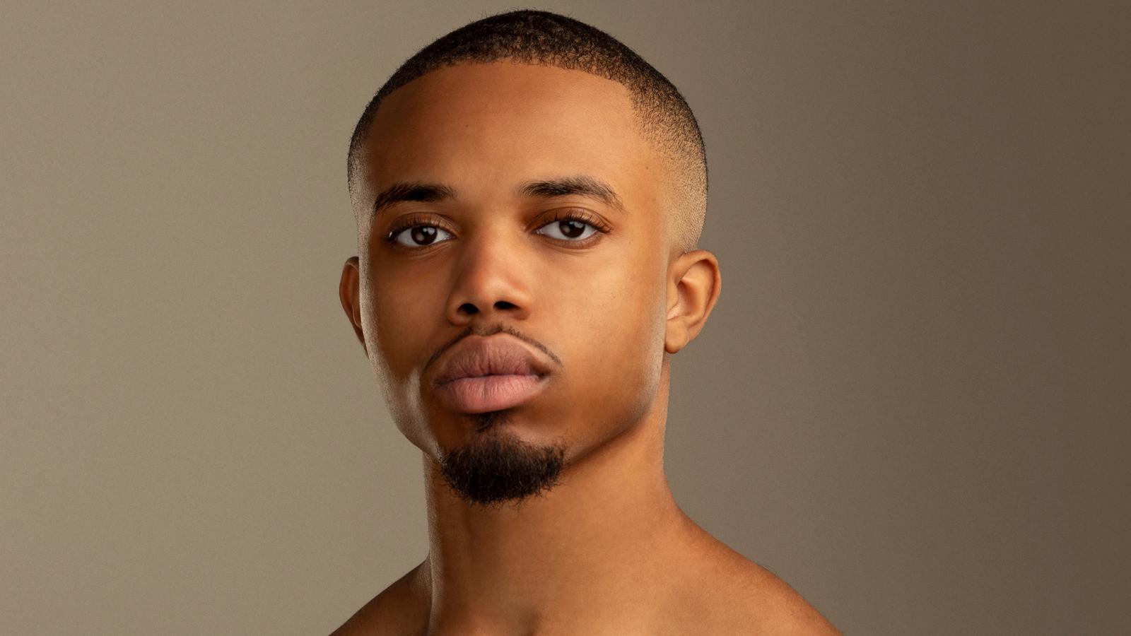 A headshot of Tyrone Reese, he has short hair and facial hair